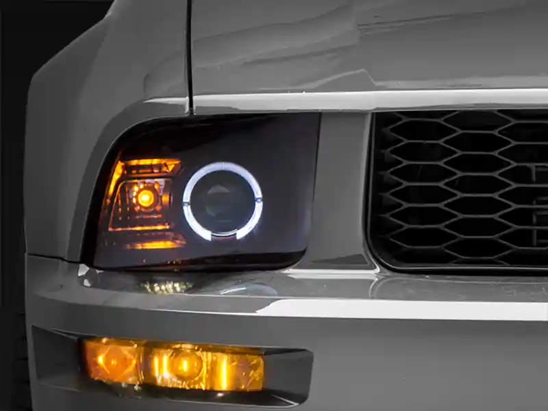 Raxiom 05-09 Ford Mustang Halogen 2010 Style LED Halo Headlights-Blk Hsng(Clear Lens/Excludes GT500) (RAX101682)