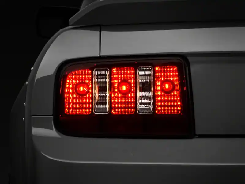 Raxiom 05-09 Ford Mustang Coyote Tail Lights- Blk Housing (Smoked Lens) (RAX49117)