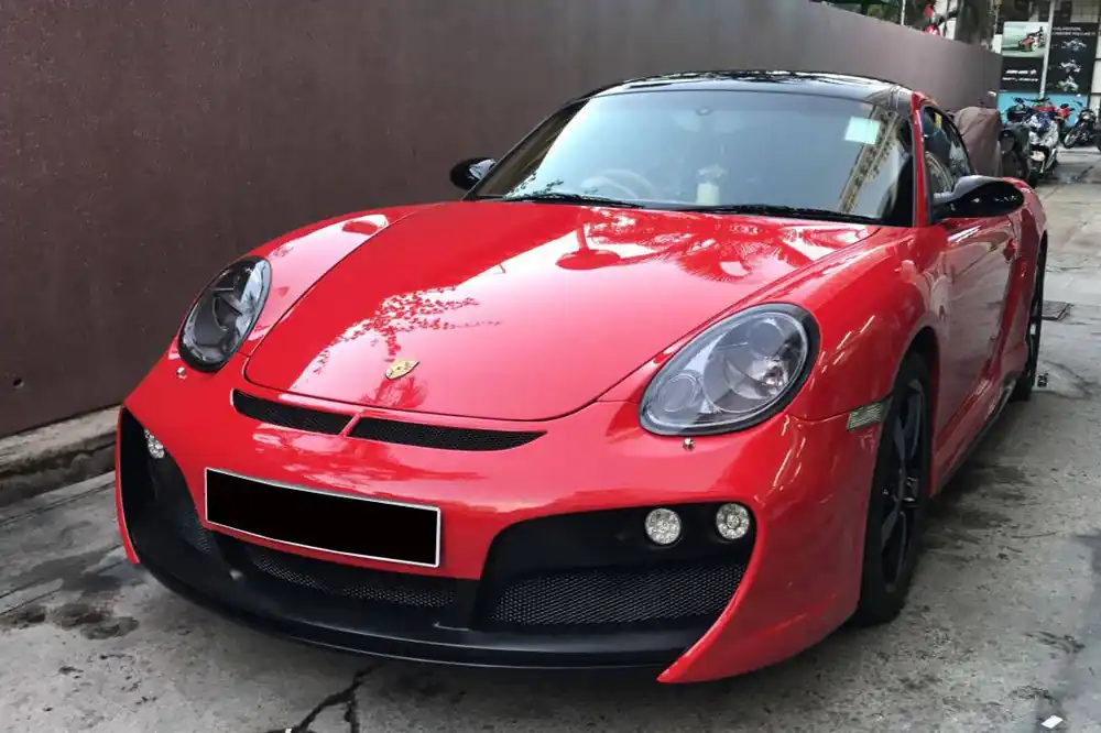Carbonado 2005-2008 Porsche Cayman Boxster 987 TA Style Front Bumper with LED Lights
