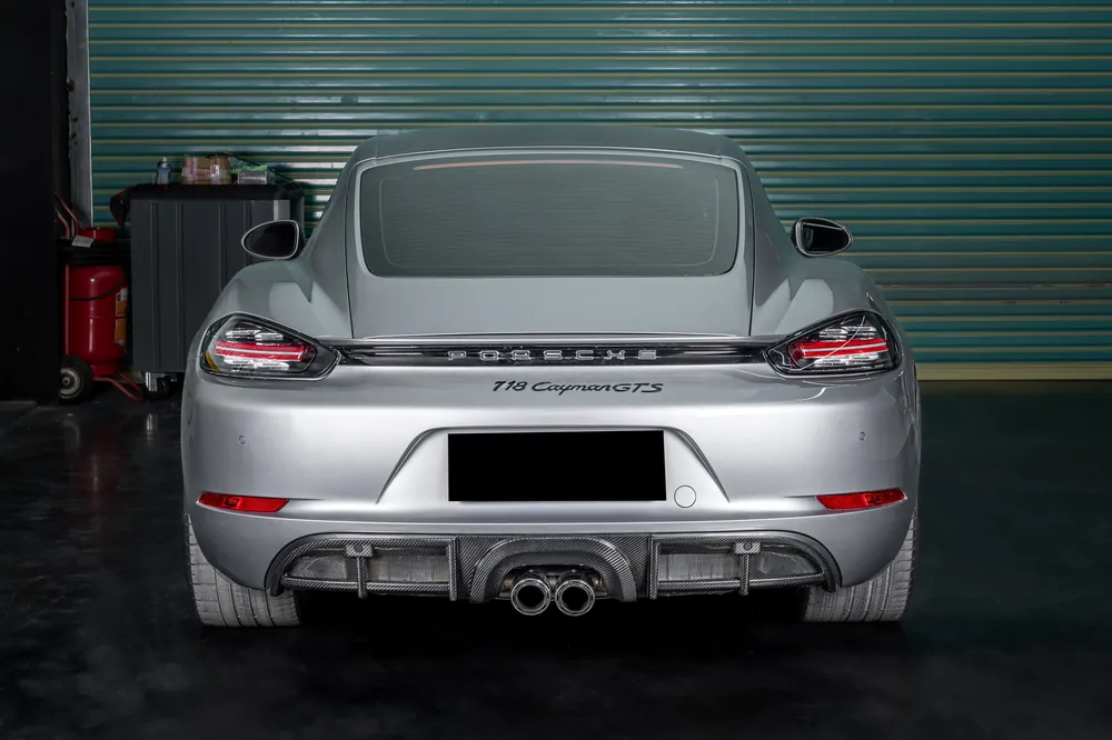 Carbonado 2017-2025 Porsche 718 Cayman Boxster GT4 Style Dry Carbon Fiber Middle Exhaust Rear Diffuser Lip